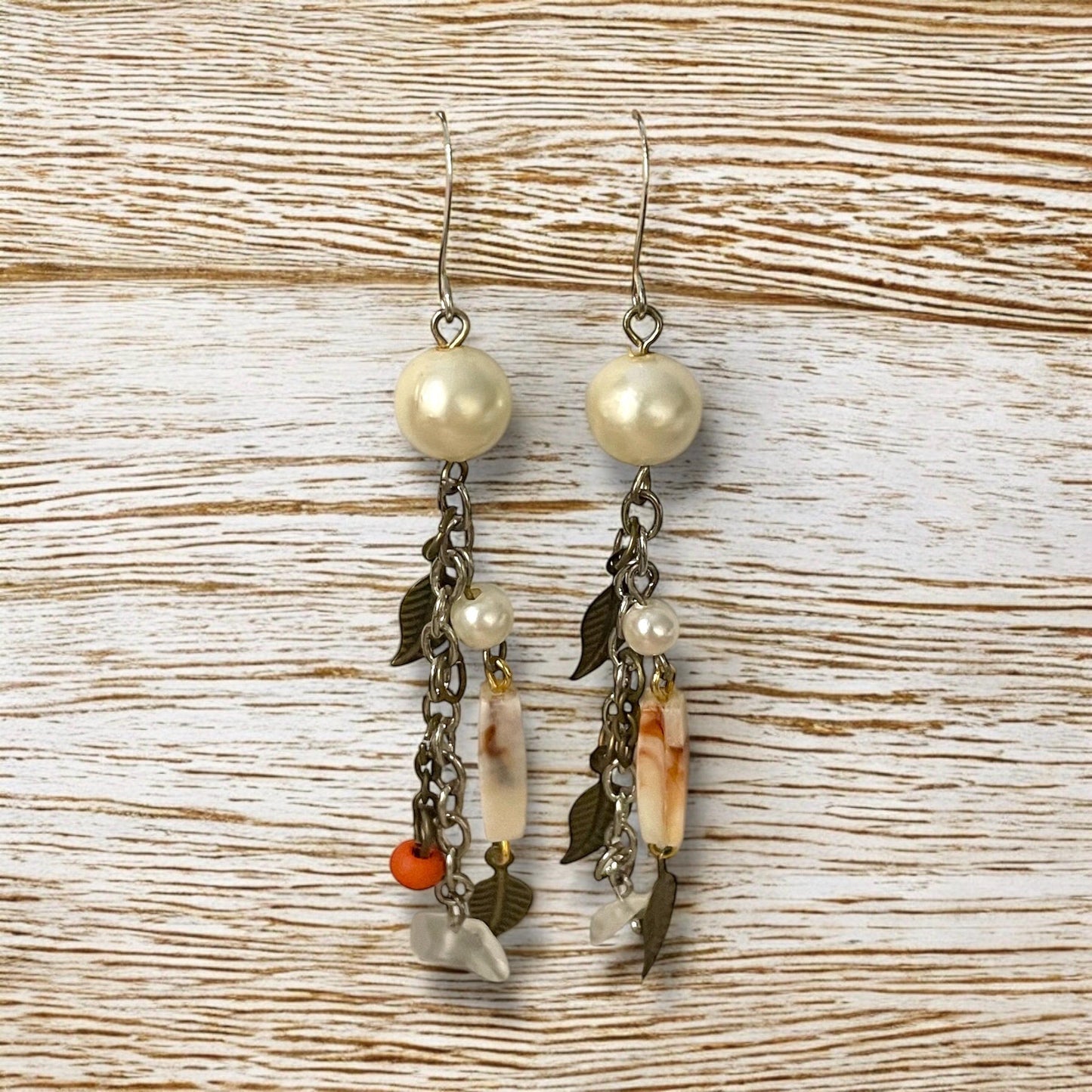 Collage inspired earrings - mixed materials including vintage metal leaves, orange wood, chain, faux pearls and ivory faux bone spacers