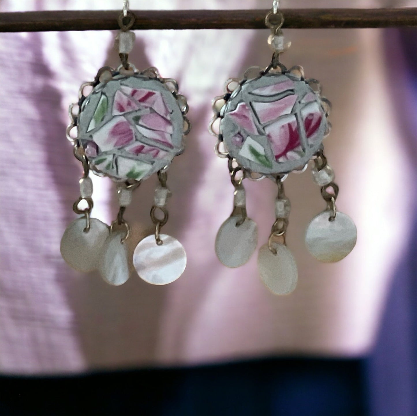 Unique earrings made of hand cut mosaic tile from vintage plates combined with mother of pearl dangles
