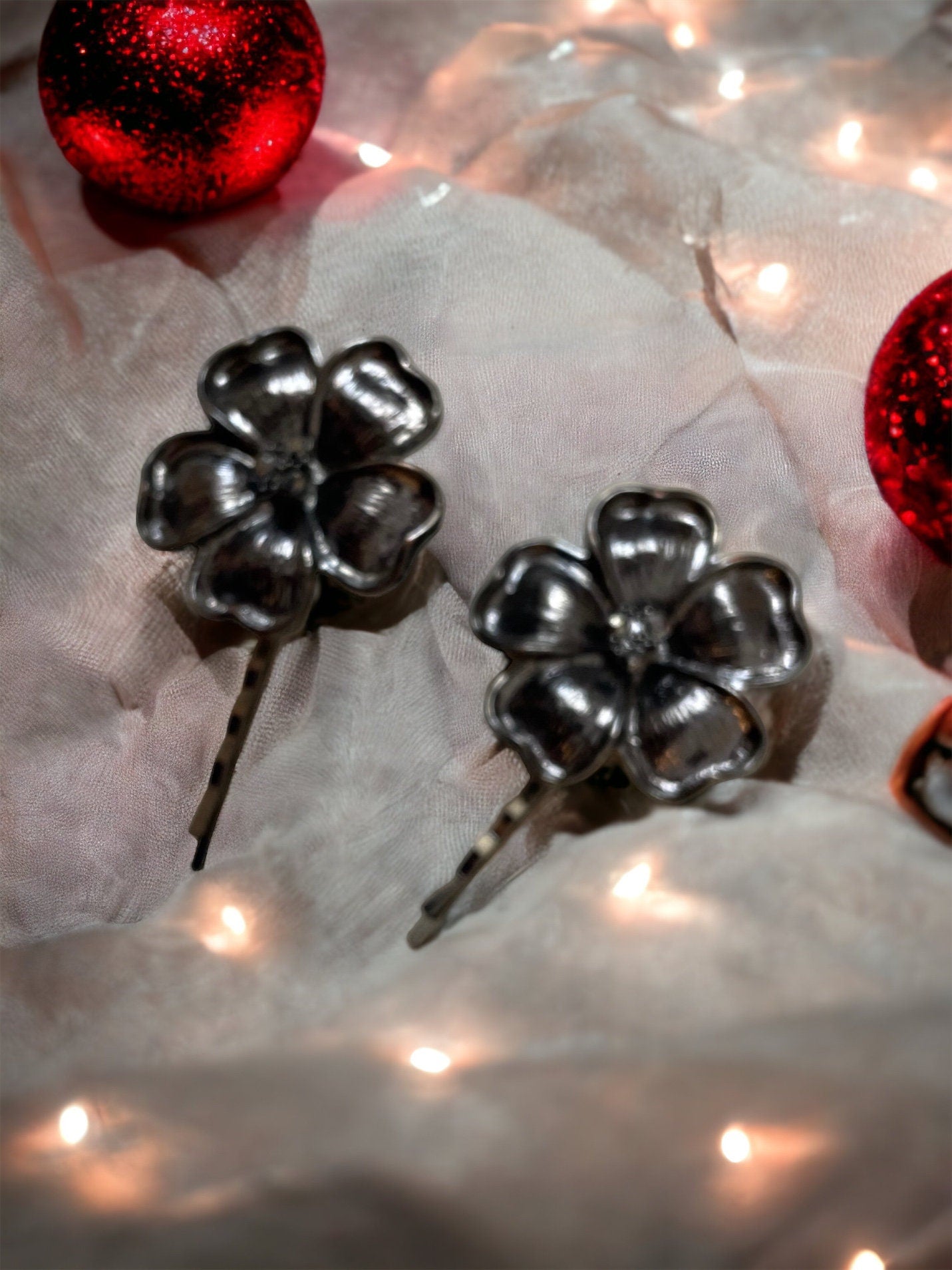 Pair of black flower hair pins with rhinestone centers
