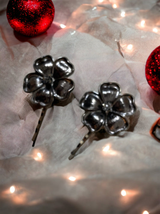 Pair of black flower hair pins with rhinestone centers