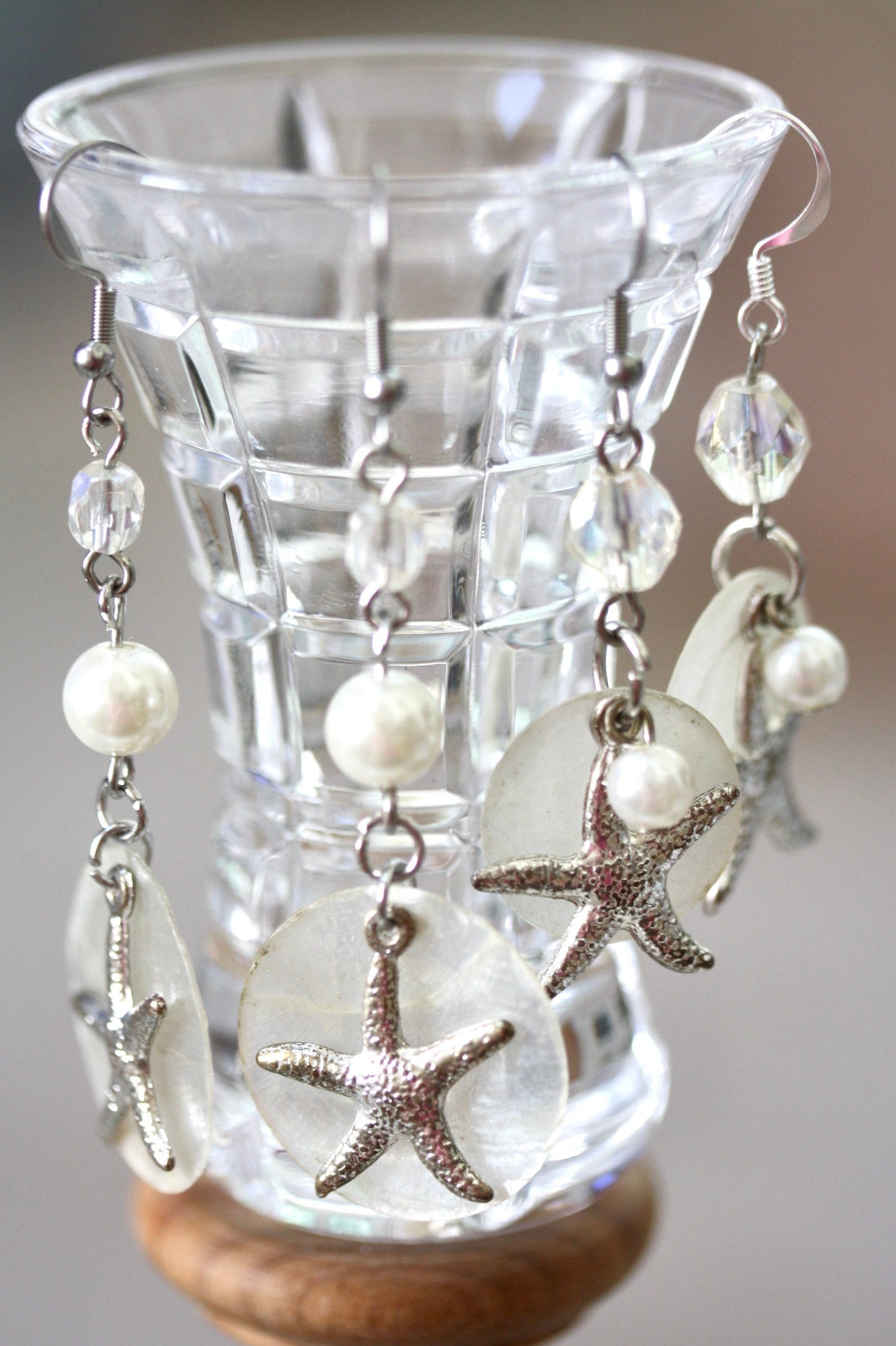Capiz shell, faux pearl and silvertone starfish beach themed dangle earrings