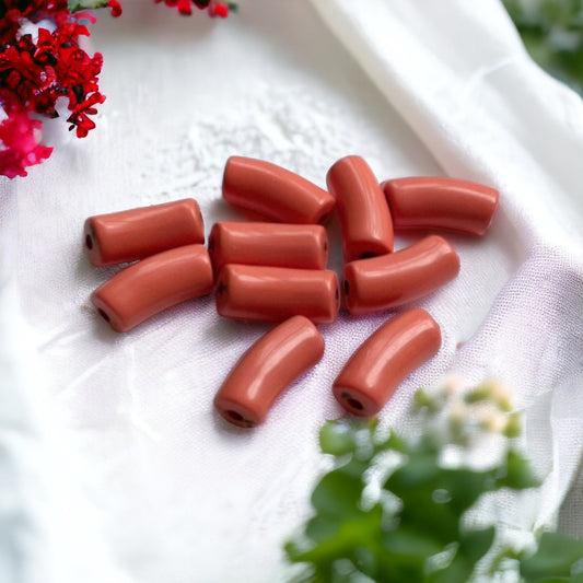 Curved light coral vintage tubular beads - approx. 30 mm each