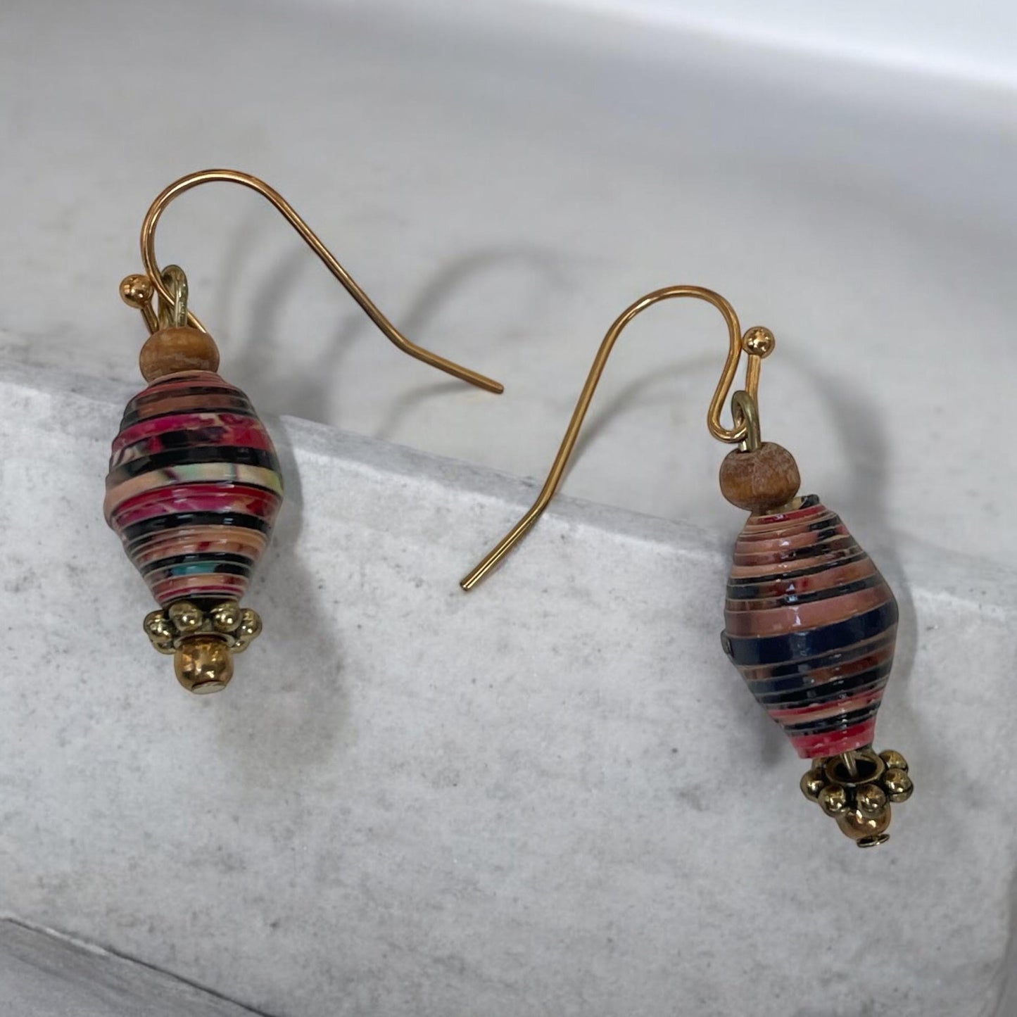 Little dangle earrings made with vintage rolled paper beads in shades of deep red, brown and cream