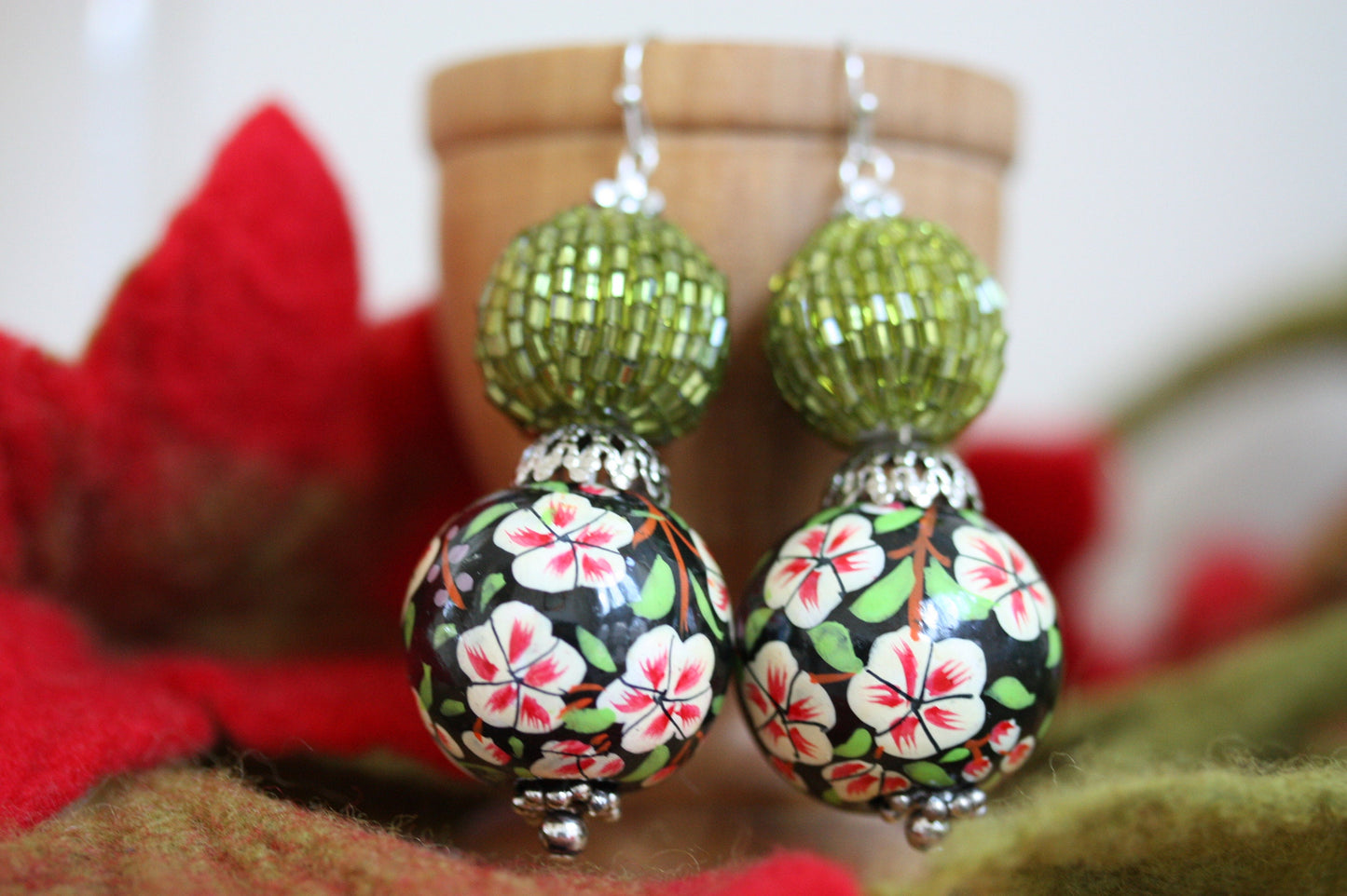 Green beaded bead and floral painted wood dangle earrings