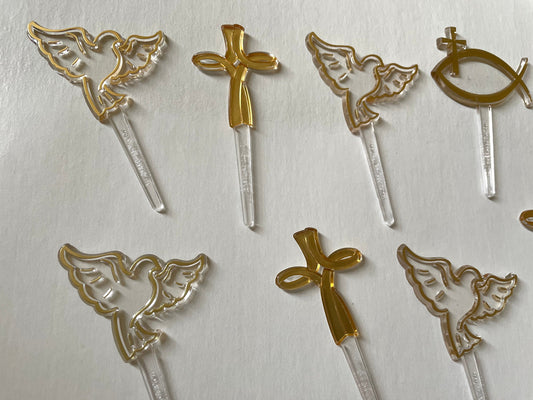 Mix of clear and gold plastic cake toppers - cross, fish and dove