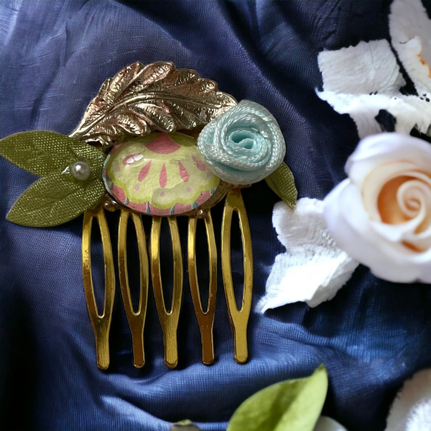 Garden inspired mixed material small 1" hair comb with antiqued metal leaf, paper sealed glass cabochon, satin flower/leaves
