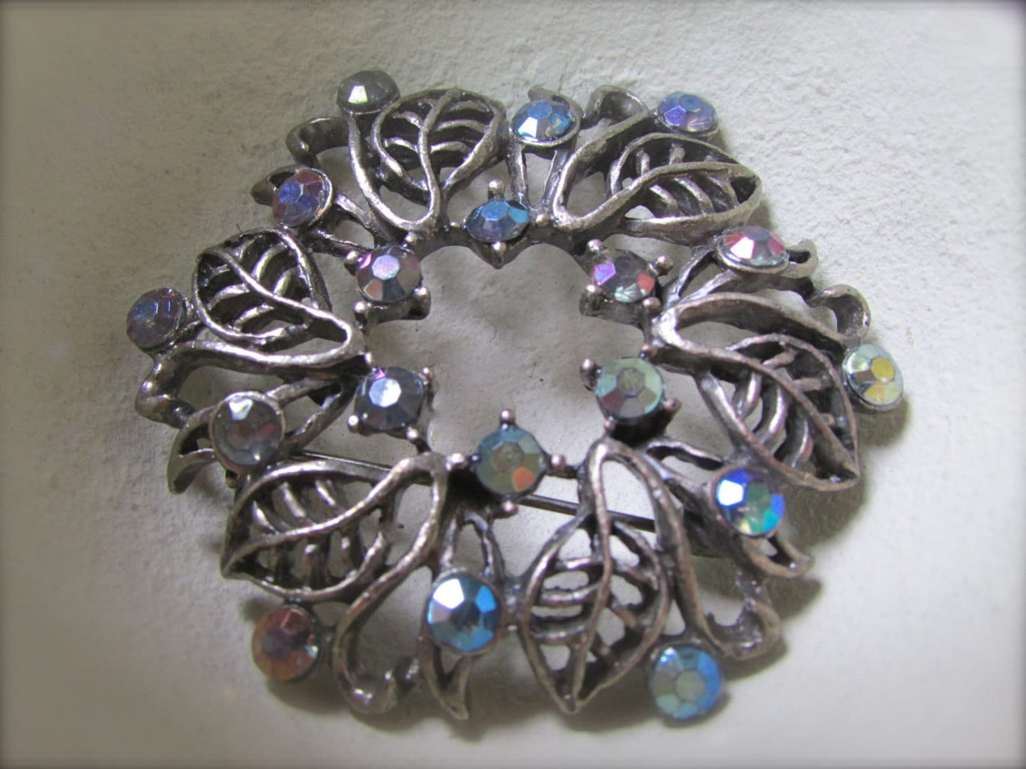 Vintage silver leaf and rhinestone wreath pin