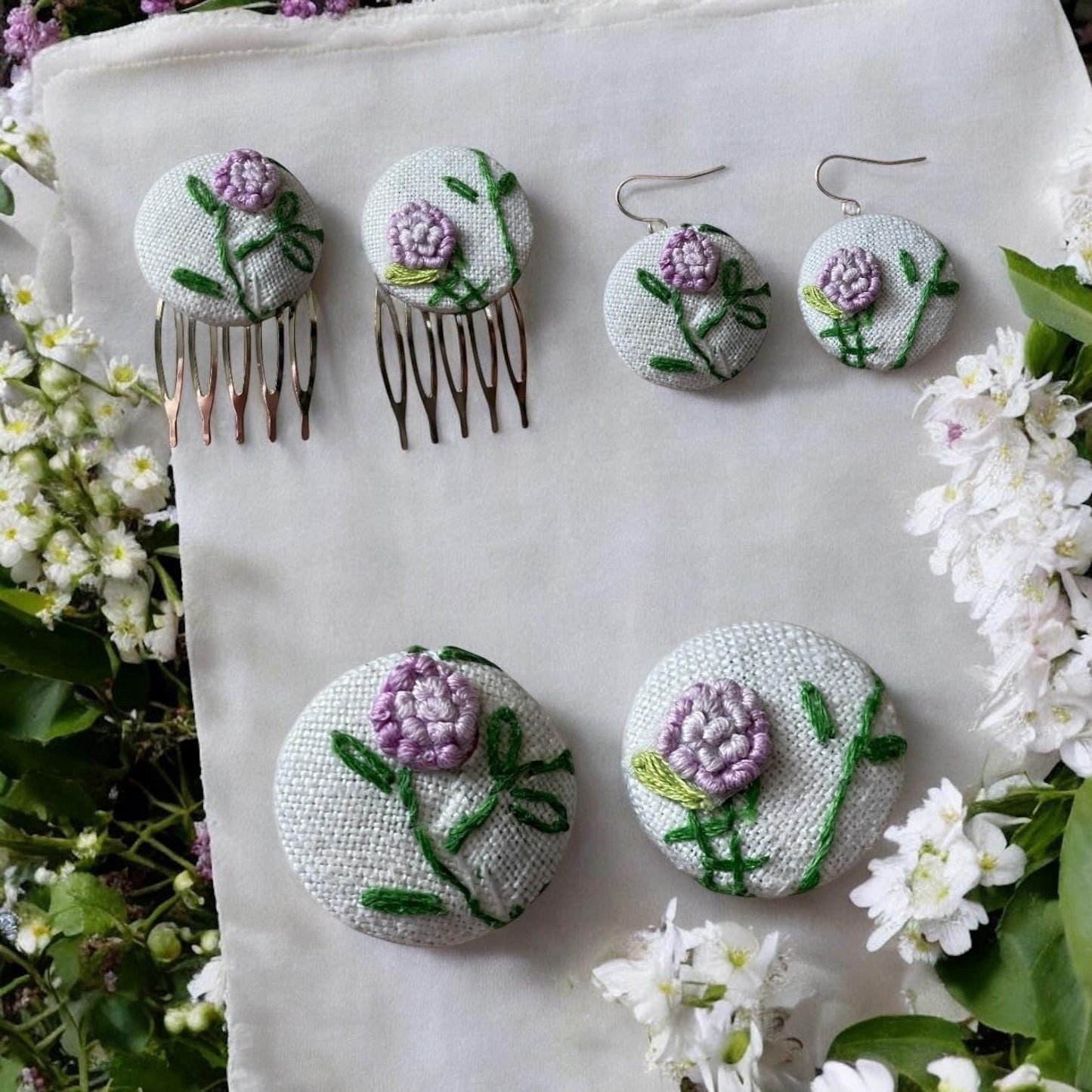 Choice of stud earrings, dangle earrings, hair combs, shanked buttons or pins all hand made from a vintage linen embroidered table runner