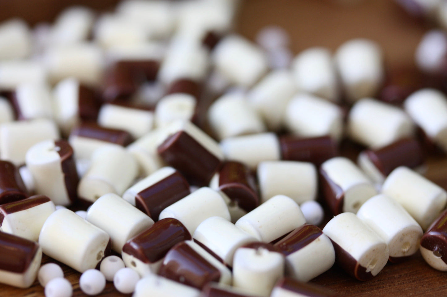 One dozen unique half brown, half creamy white vintage beads