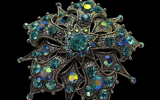 Magnificent vintage pin loaded with blue AB rhinestones