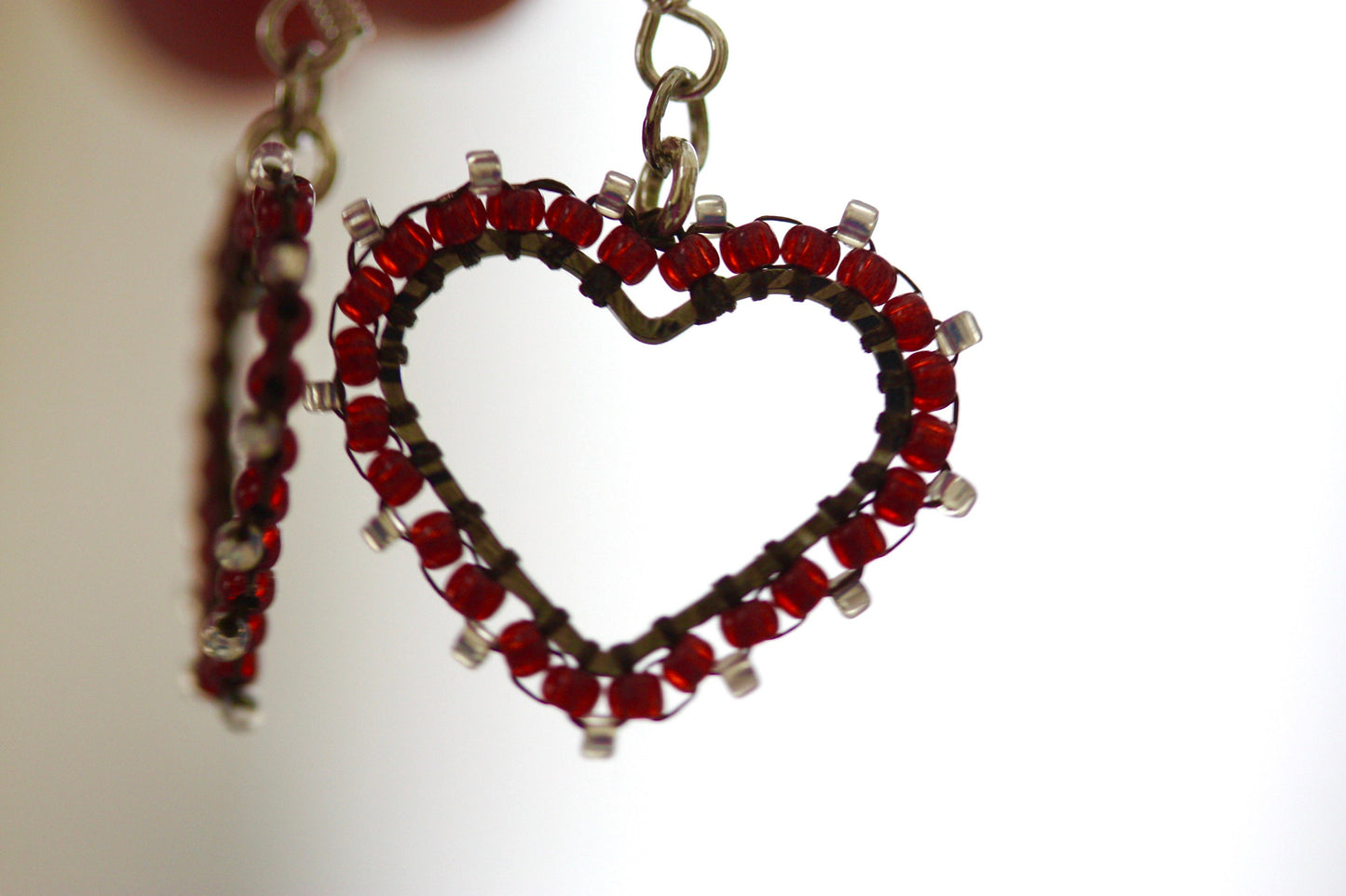 Small intricately beaded heart dangle earrings - original beadwork