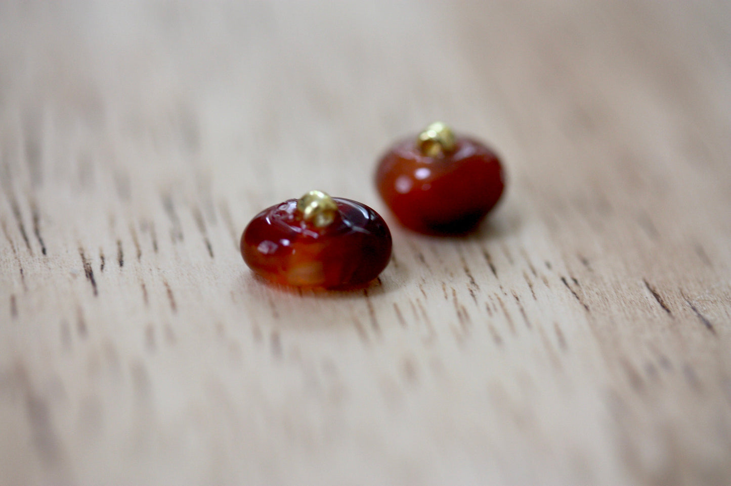 Small little orange glass stud earrings