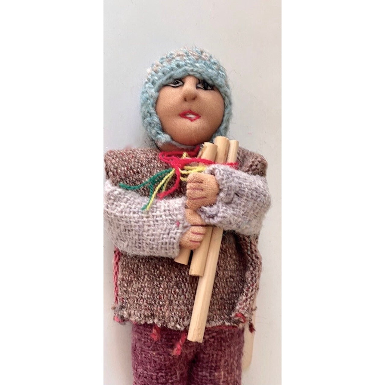 Vintage Bolivian man playing panpipes - collectible folk art doll with handmade woven wool clothing