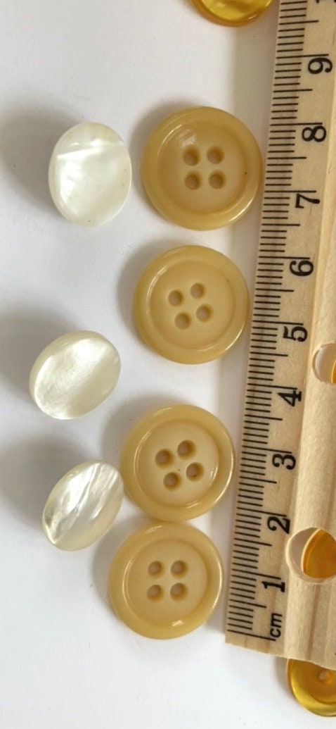 Lot of vintage buttons - from Holland and elsewhere - shades of yellow, gold and cream