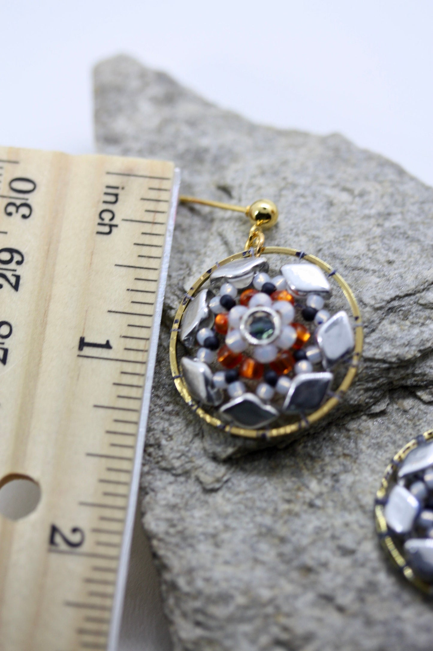 Orange and navy blue intricate beadwork small circular dangle earrings