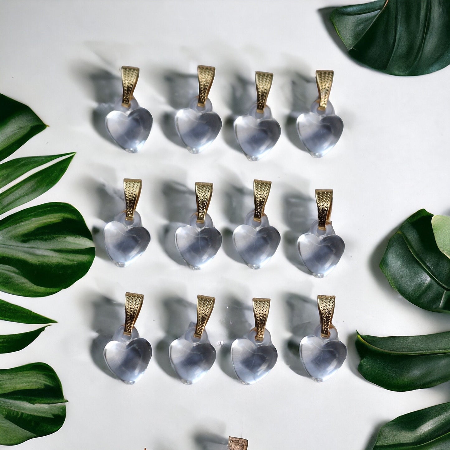 One dozen clear heart pendants - can be used as necklace pendants or for making earrings
