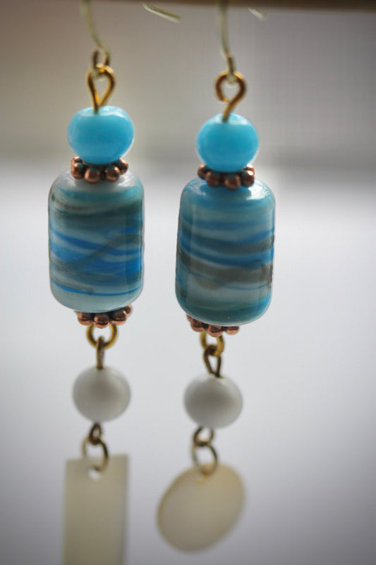 Long dangle earrings made of both new and vintage components -blue and gold art glass, mother of pearl dangles,vintage blue and white beads