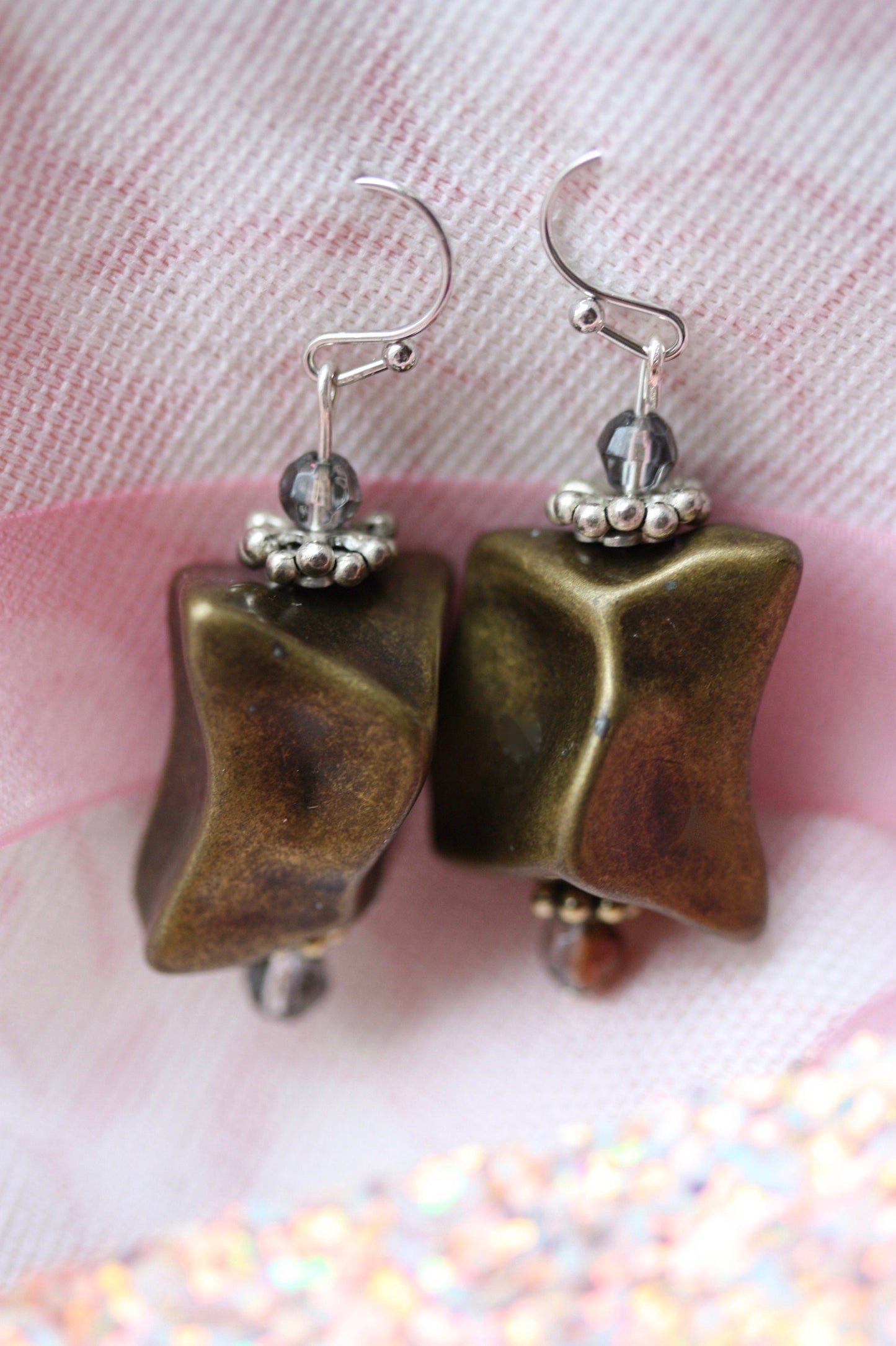 Handmade dangle earrings made with uniquely shaped faux stone beads