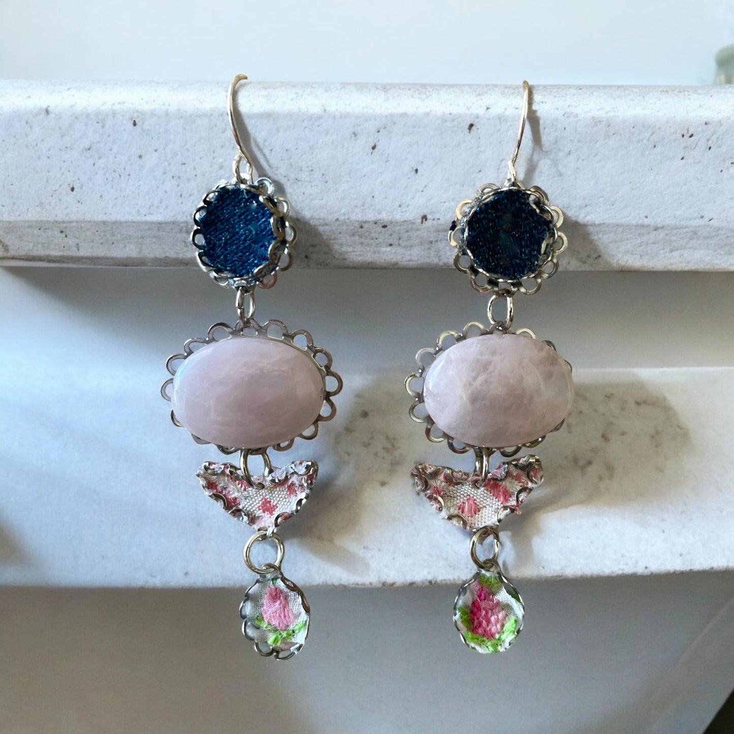 Handmade earrings featuring rose quartz, metal findings, denim, pink dotted fabric, embroidered flowers.  Sterling silver ear wires.