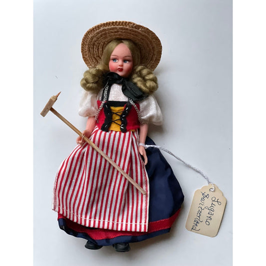 Vintage collectible handmade doll from Luganos Switzerland - with traditional handmade clothing and wooden rake