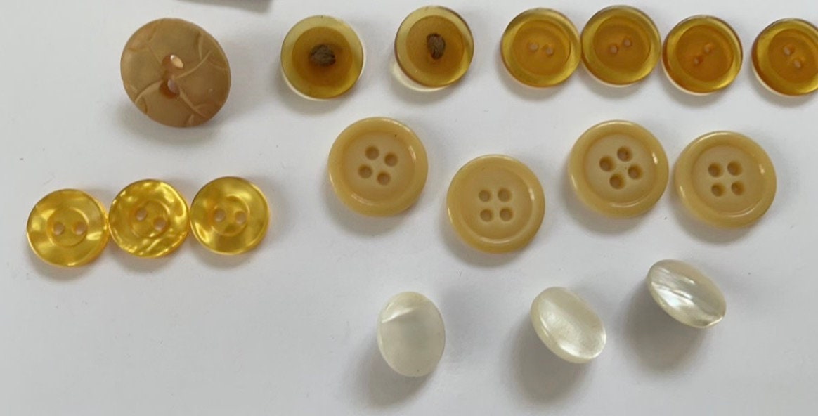 Lot of vintage buttons - from Holland and elsewhere - shades of yellow, gold and cream