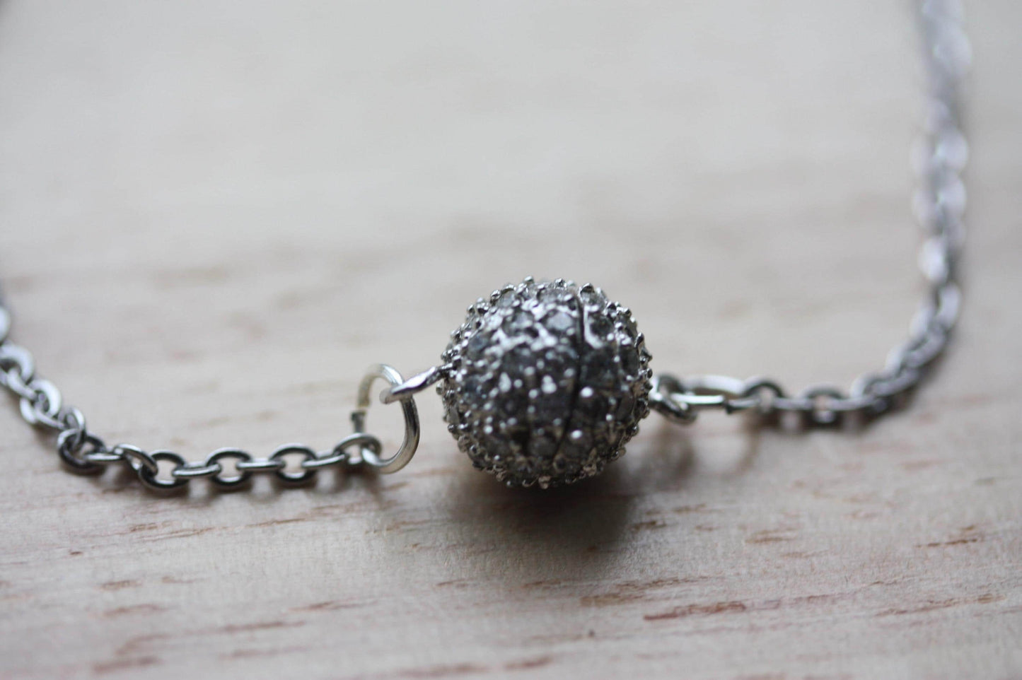 Handmade bracelet made with unique round marcasite ball that is the focal point and also unwinds as the clasp