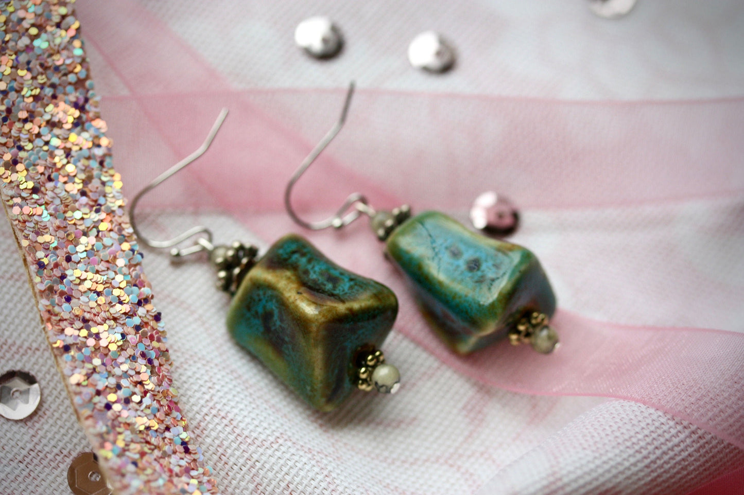 Handmade dangle earrings made with uniquely shaped faux turquoise beads