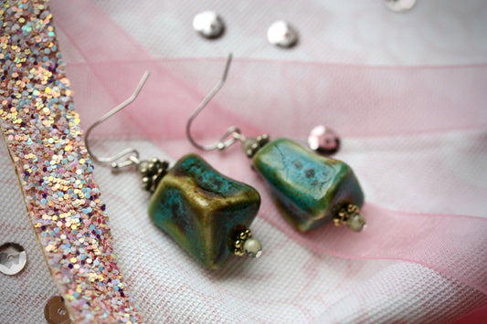 Handmade dangle earrings made with uniquely shaped faux turquoise beads