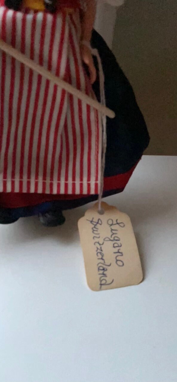 Vintage collectible handmade doll from Luganos Switzerland - with traditional handmade clothing and wooden rake