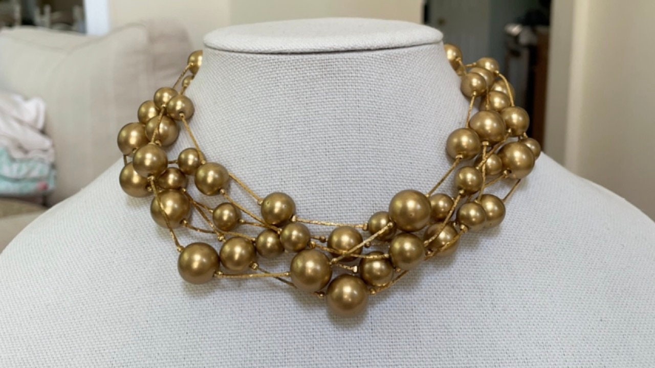 Stunning vintage multi strand goldtone faux pearl necklace