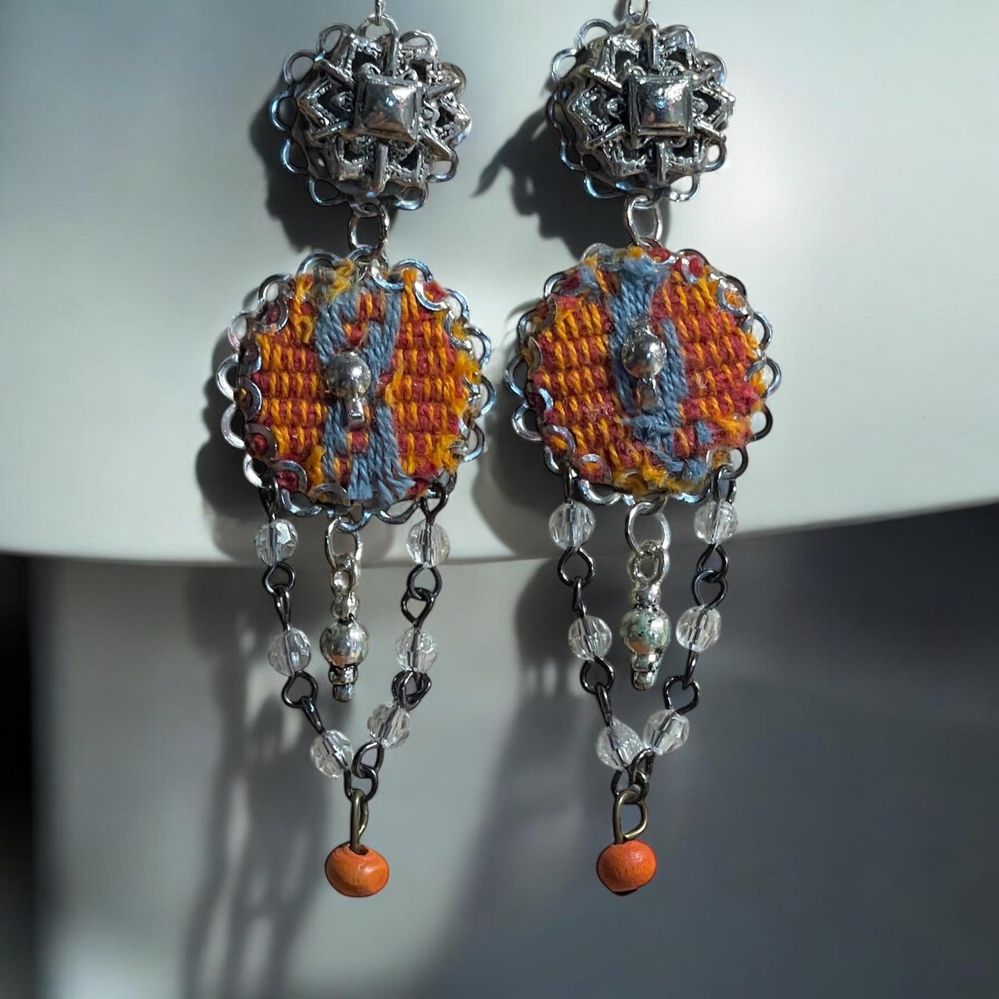 Orange and gray mixed media collage earrings with mixed metals, fabric, crystal and wood; Sterling silver ear wires