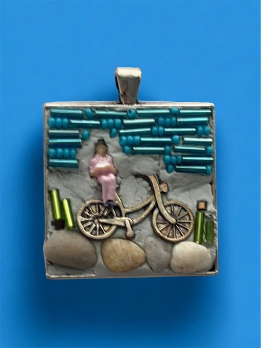 My own handmade micro mosaic mixed material collage necklace - woman resting on her bicycle