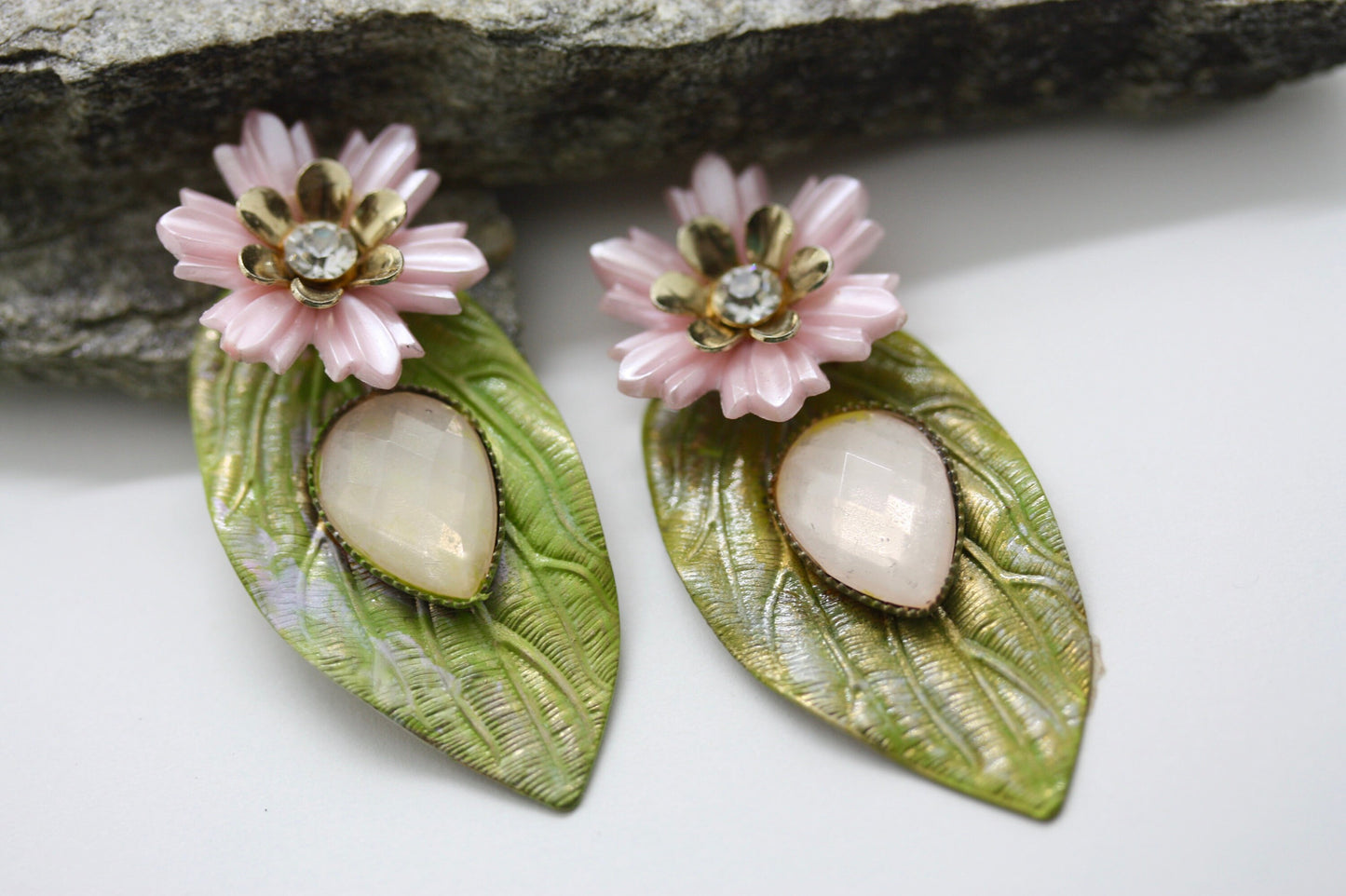 Hand painted leaf earrings with inlaid cabochan, vintage mixed material pink and metal flowers and capped off with rhinestone center
