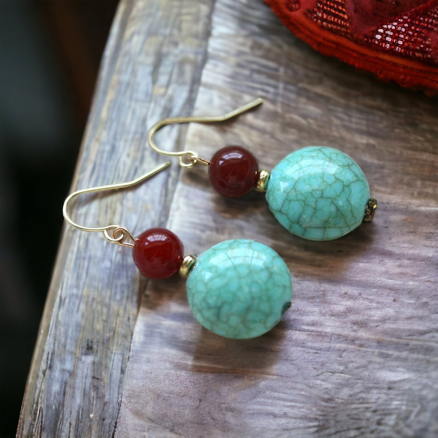 Dangle earrings made of faux turquoise and deep red glass