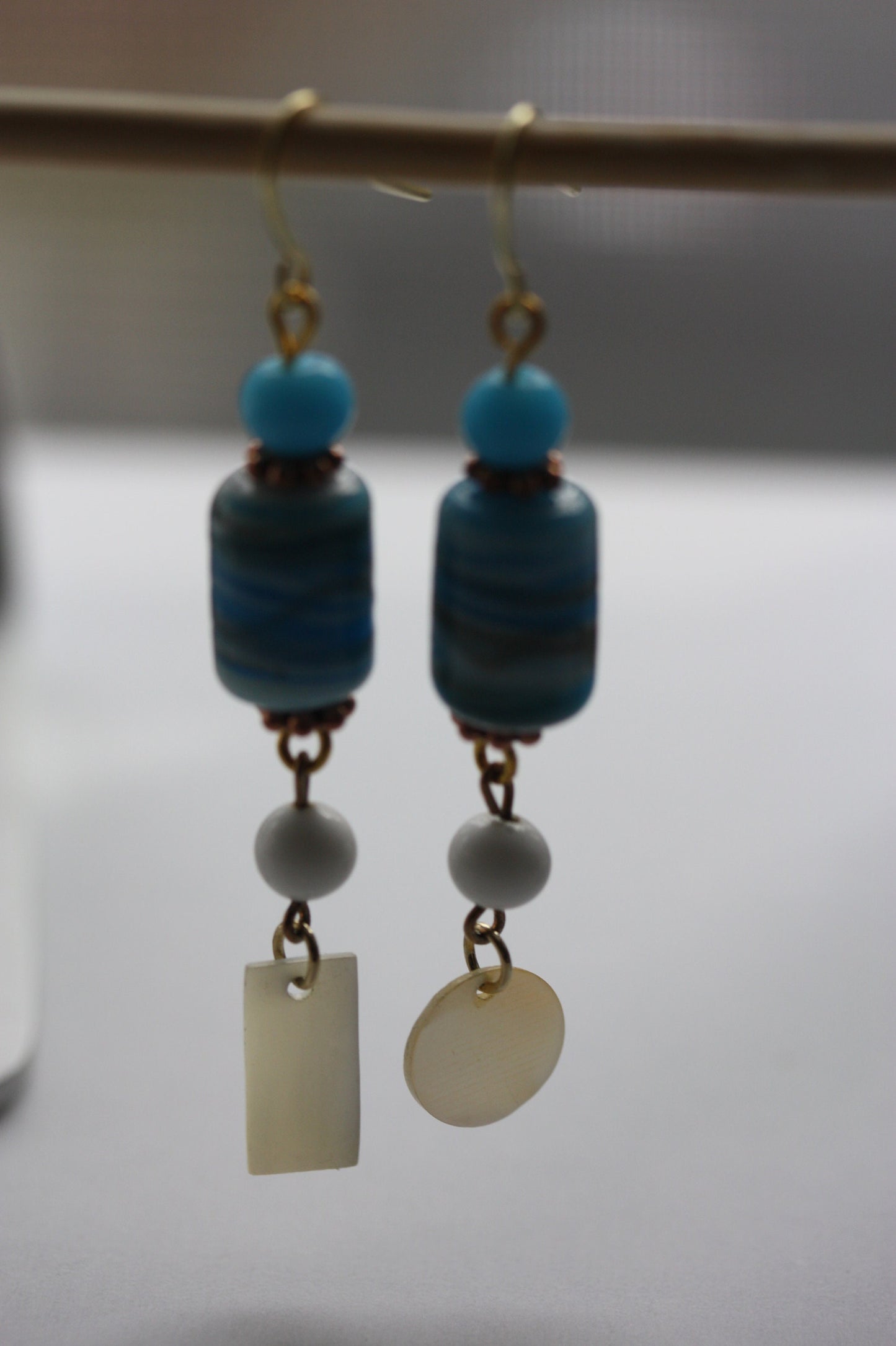Long dangle earrings made of both new and vintage components -blue and gold art glass, mother of pearl dangles,vintage blue and white beads