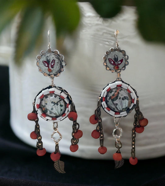 Hand cut micro mosaic millefiori glass dangle earrings surrounding butterfly wing image with orange wood dangles and feather charms