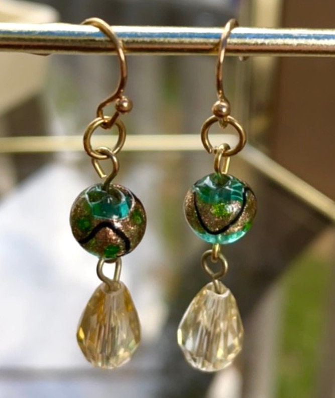 Handmade dangle earrings with green and gold art glass and faceted crystals