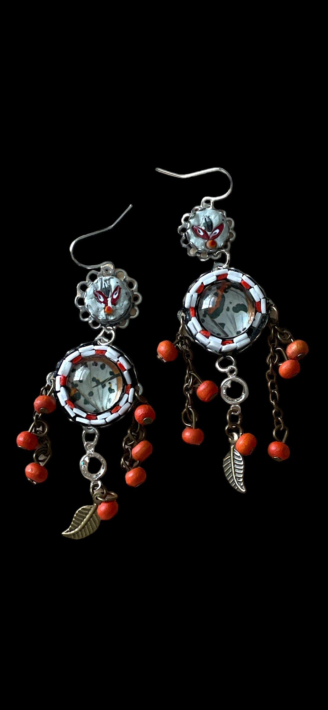 Hand cut micro mosaic millefiori glass dangle earrings surrounding butterfly wing image with orange wood dangles and feather charms