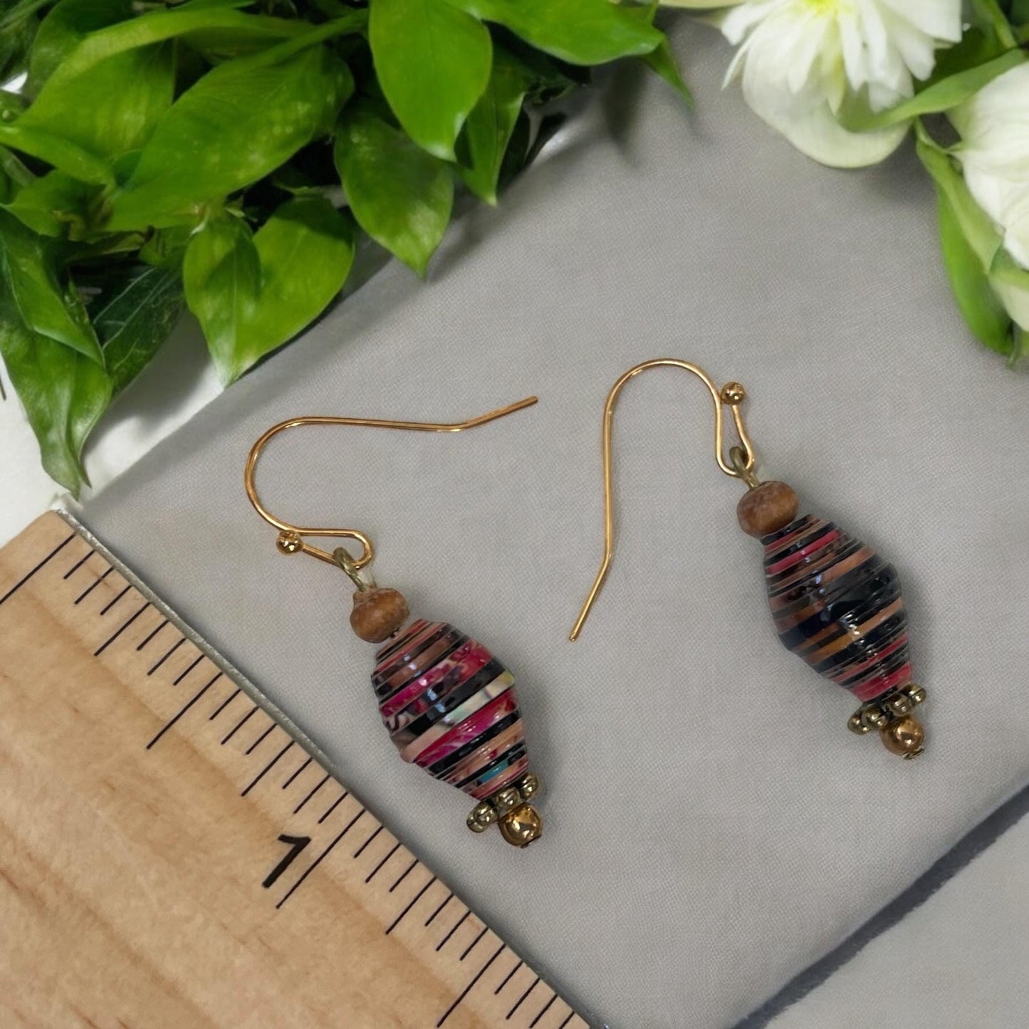 Little dangle earrings made with vintage rolled paper beads in shades of deep red, brown and cream