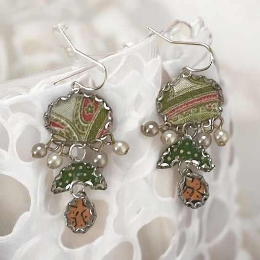 Handmade earrings featuring green and white polka dot fabric with peach and cream paisley and dangling faux pearls. Sterling ear wires.