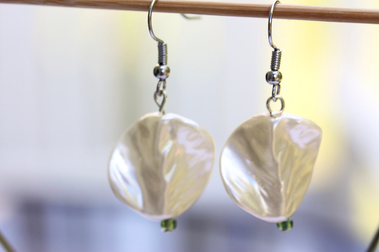 Pearlescent leaves dangle earrings trimmed with tiny sparkly seed beads