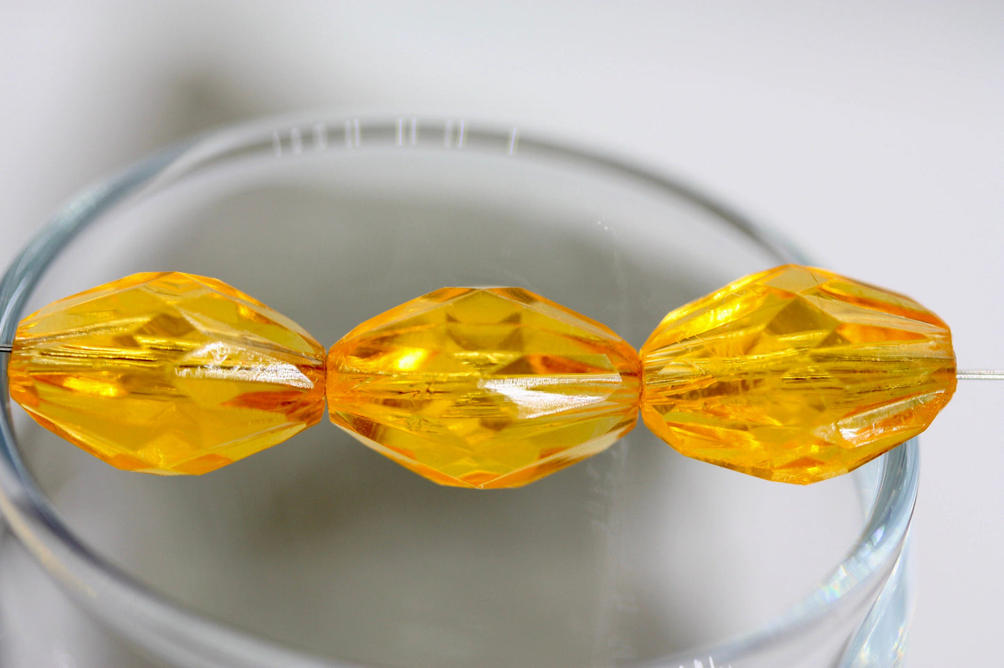 Orange oval faceted vintage beads - approx. 15 mm