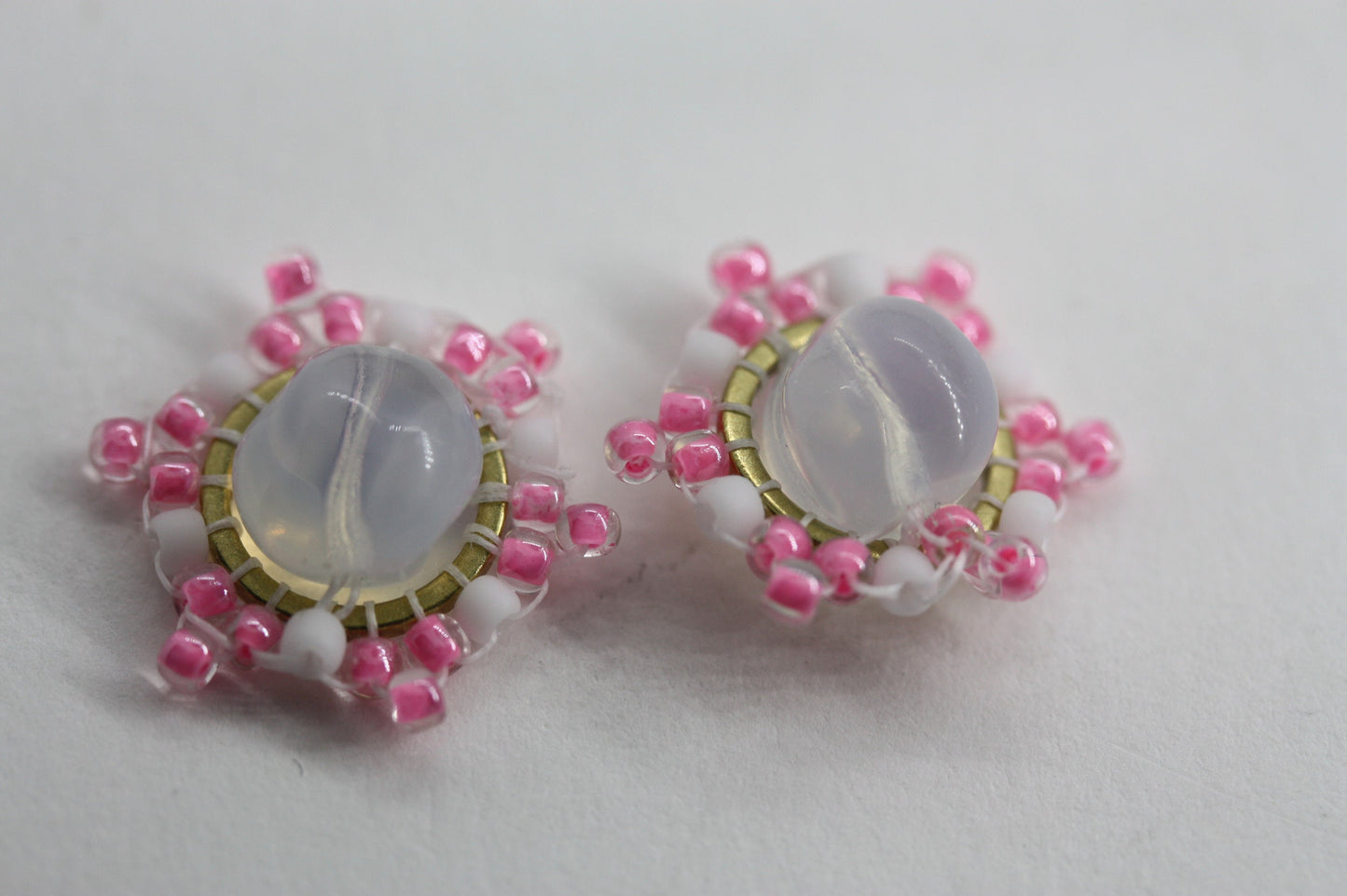 Hand beaded stud earrings - pink and white beadwork around transluscent opalescent glass bead
