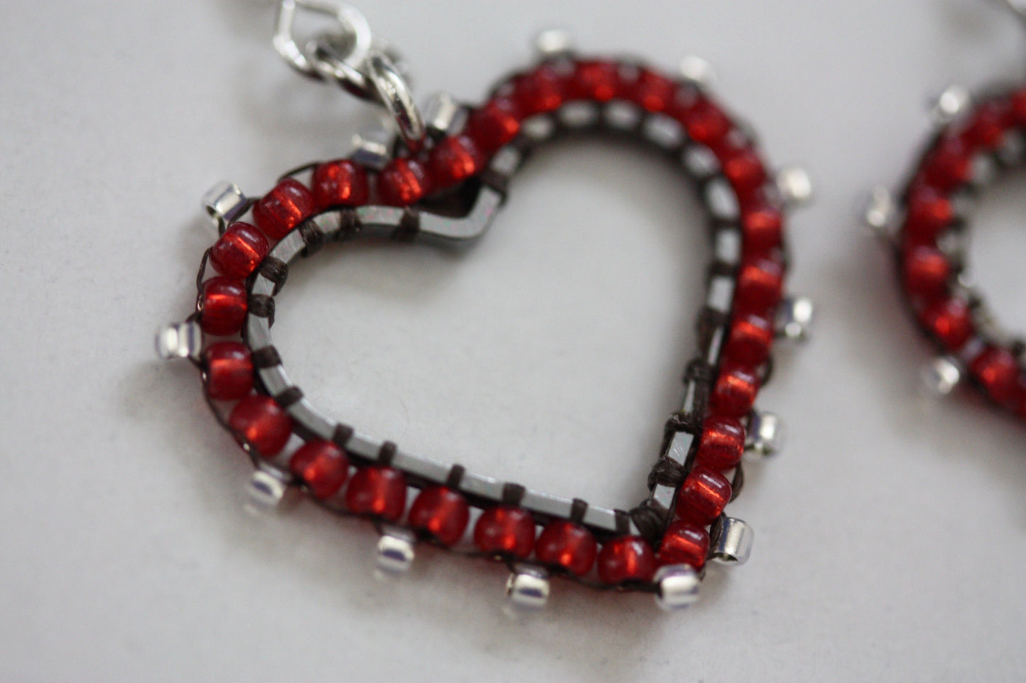 Small intricately beaded heart dangle earrings - original beadwork
