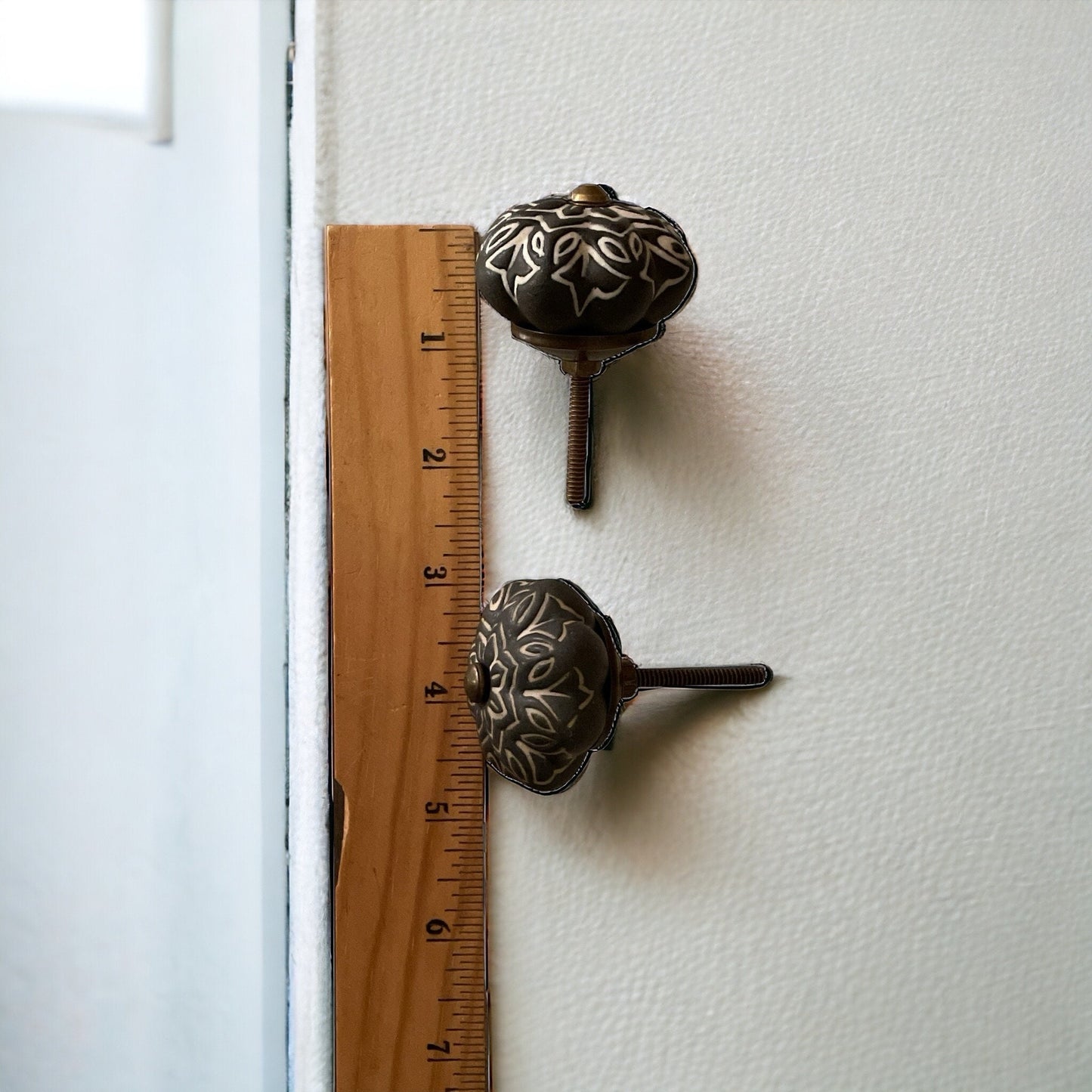 Pair of black and white vintage drawer pulls