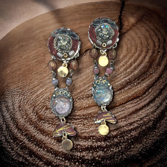 One-of-a-kind earrings made with, paper, fabric, velvet, rhinestones, chain, mixed metals and postage stamp remnants. Sterling ear wires.