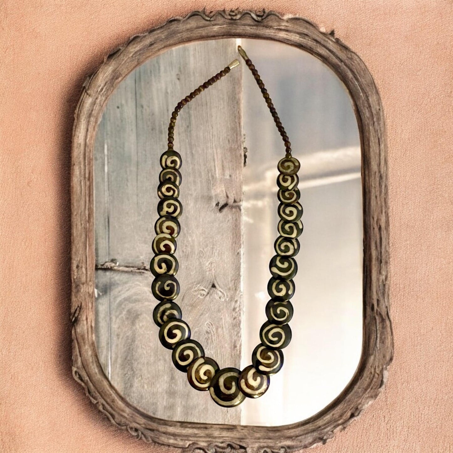 Tribal style vintage necklace - with beautiful swirled discs that are either bovine or wood?