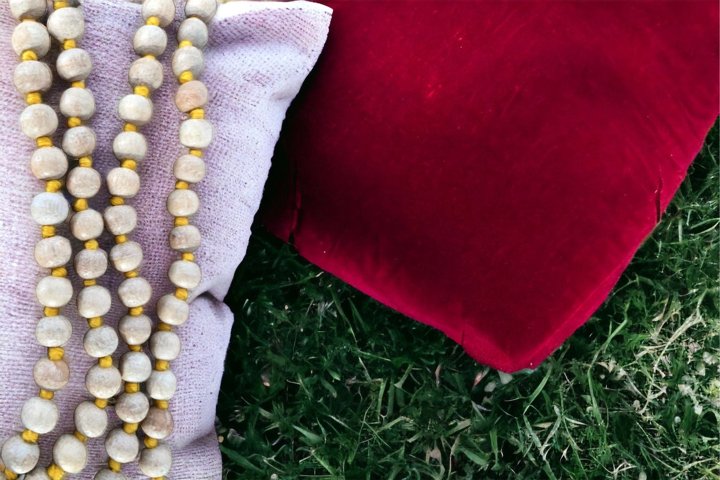 Knotted natural wood prayer bead necklace with golden yellow tassel