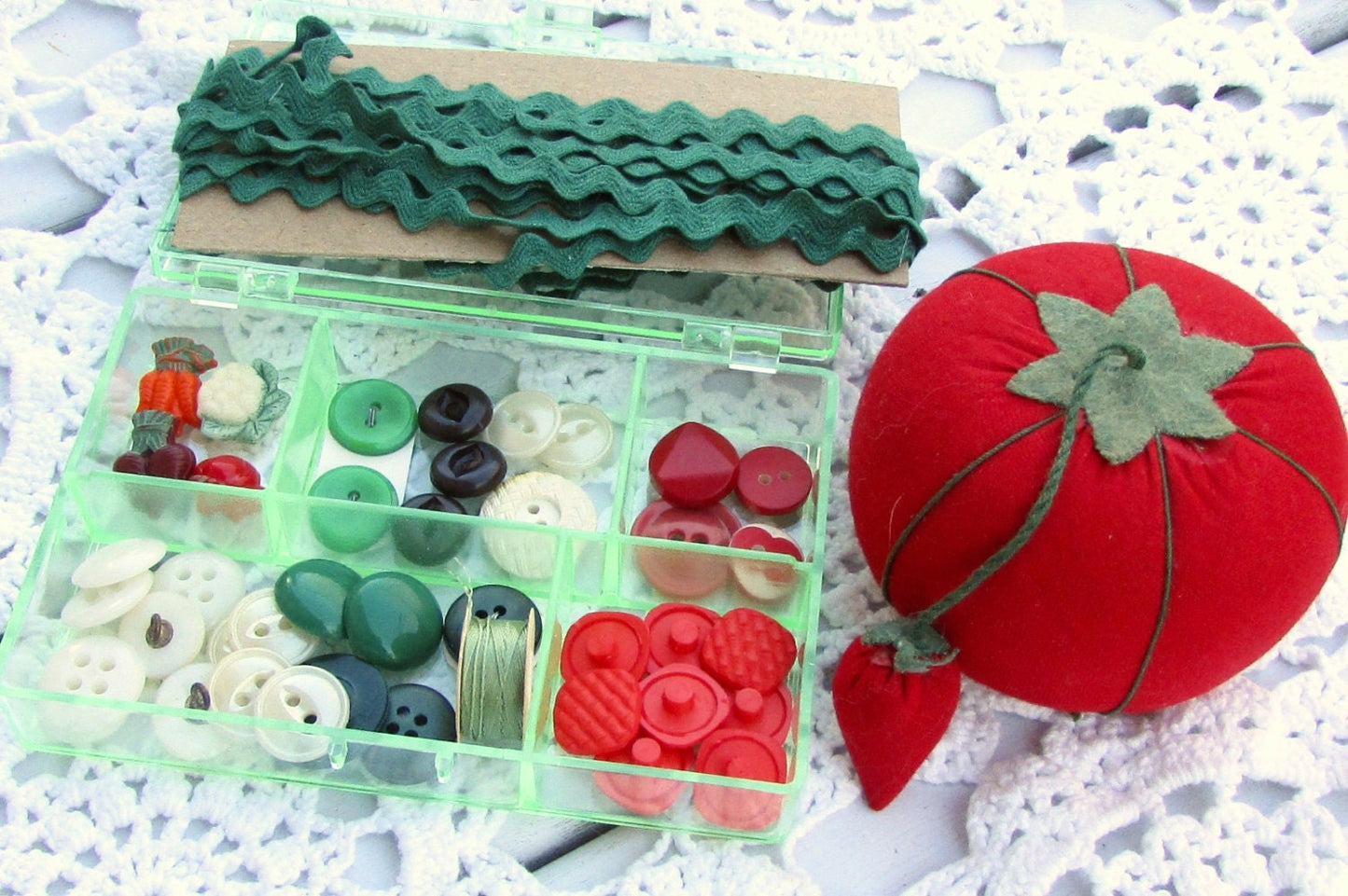Vintage sewing inspiration box - filled with vintage buttons and sewing supplies shown - vegetable theme - in the shades of red and green