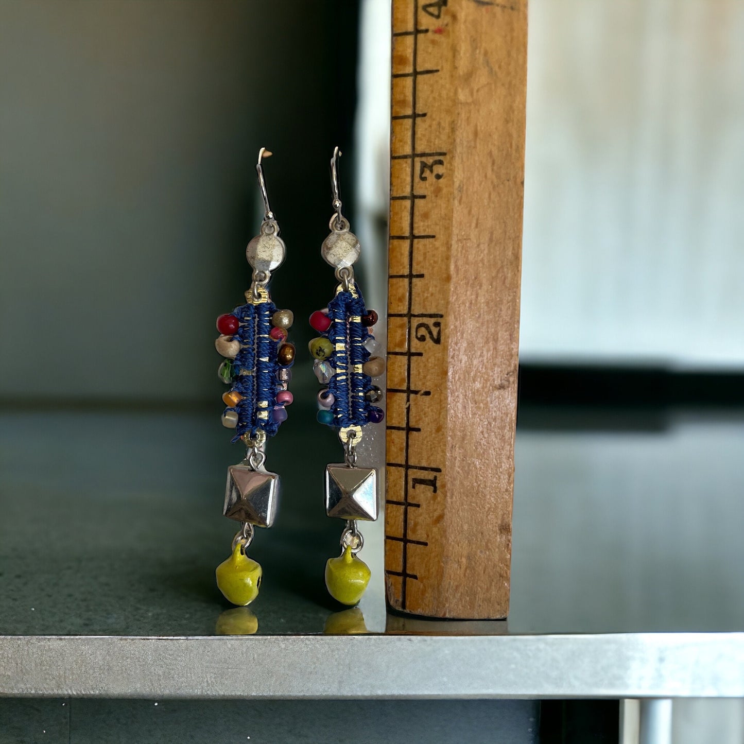 Mixed material collage earrings - metal, string, glass, and mustard yellow tiny bells